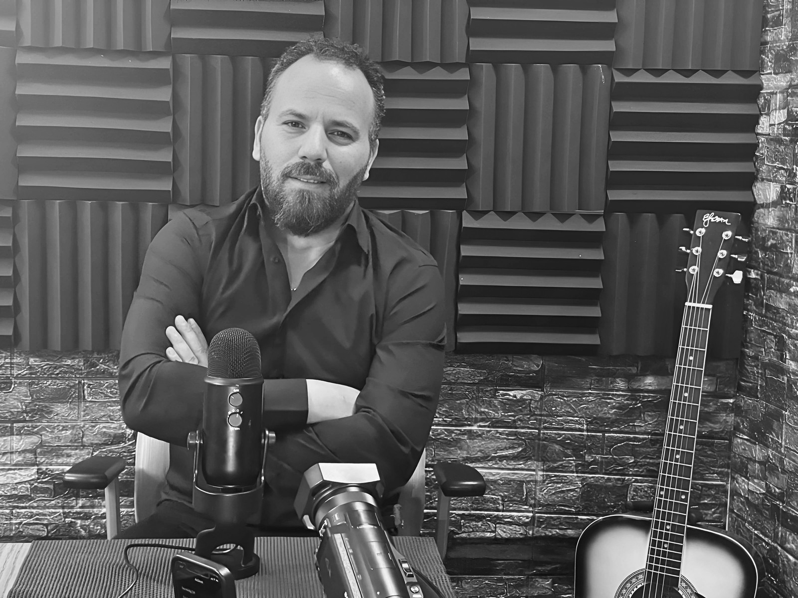 Karim Ayyoub recording a podcast in a professional media studio