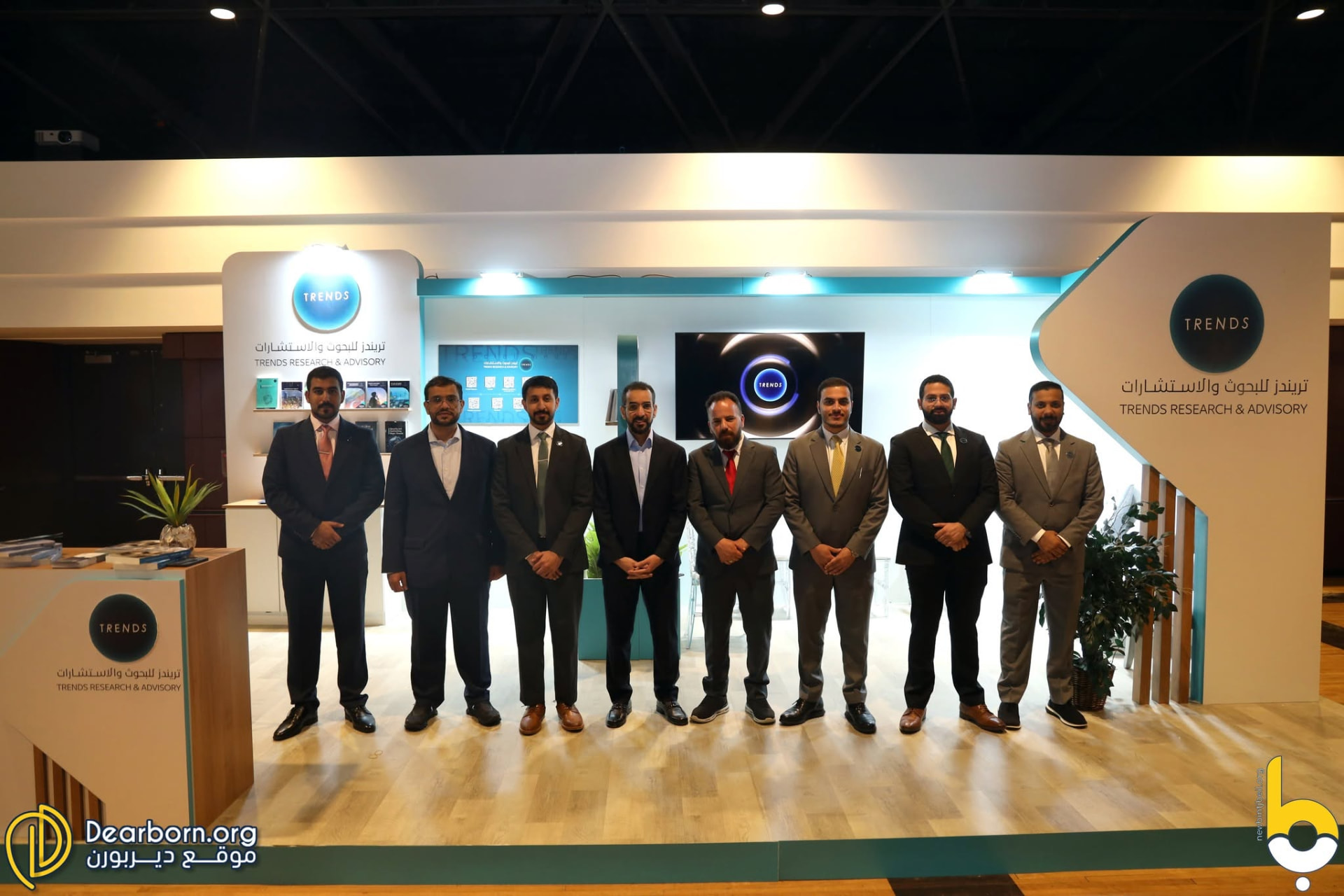 Exhibitor delegation at their pavilion booth